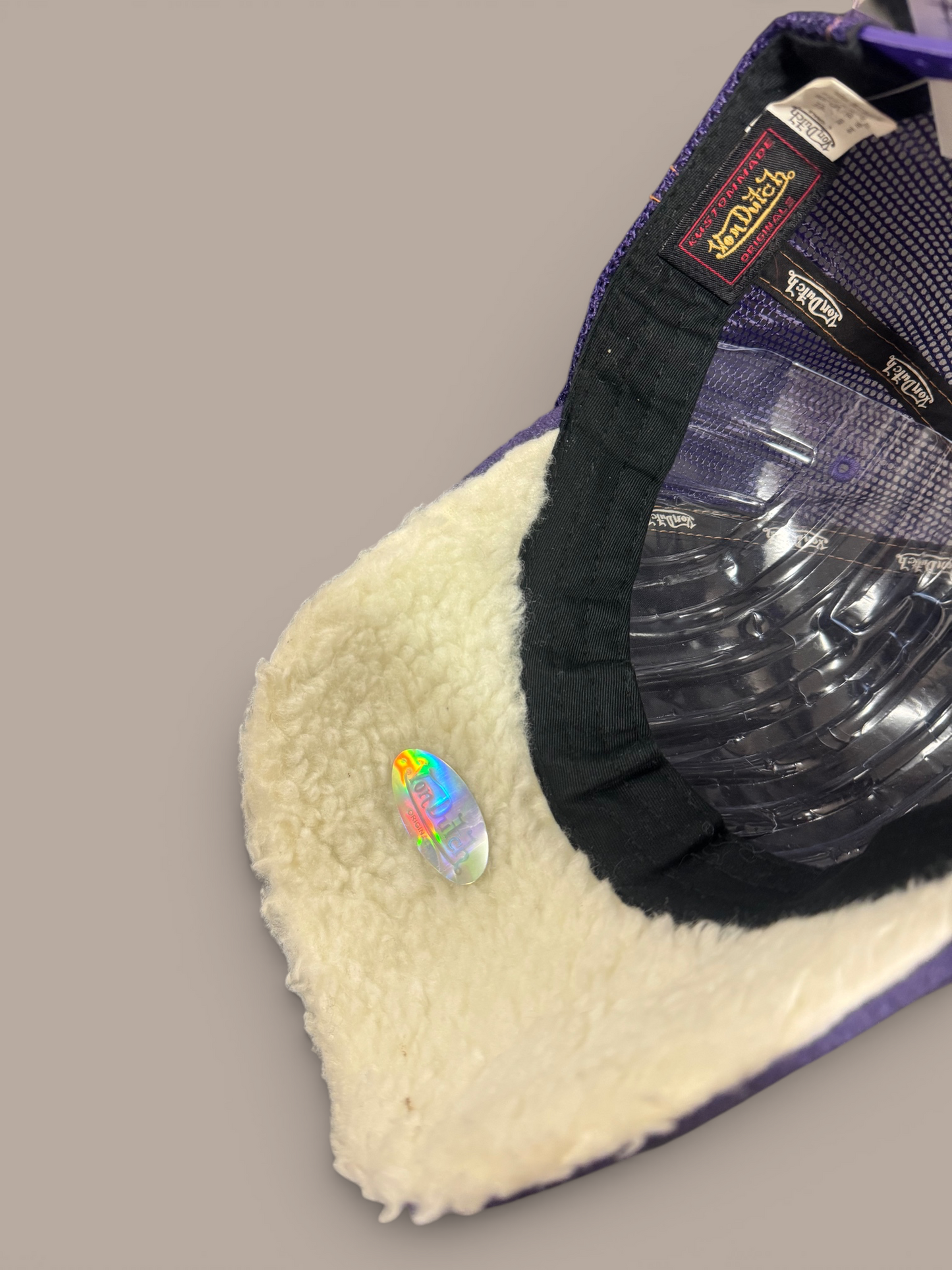 purple von dutch hat suede , fluffy on inside.